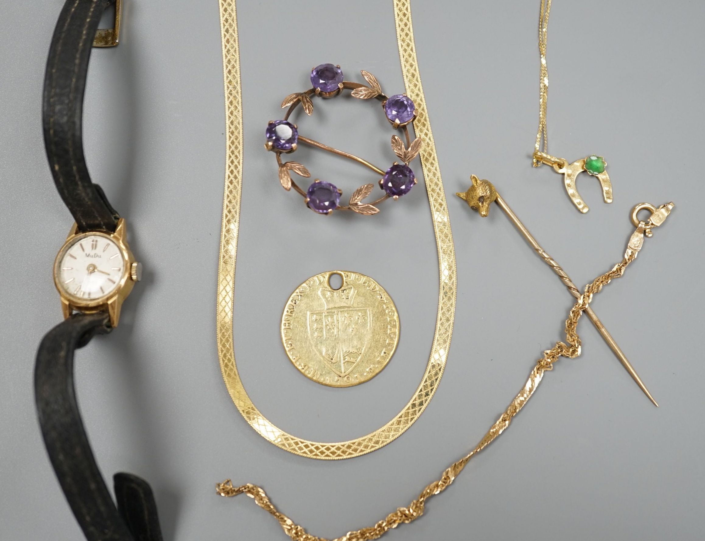 A modern 9ct gold necklet, 4.2 grams, a 14kt bracelet and necklace gross 3 grams, a worn gold coin, a yellow metal and gem set brooch, a similar fox head stick pin and a lady's 18ct Mudu wrist watch.
